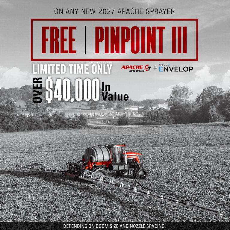 apache sprayer with booms extended in bean field